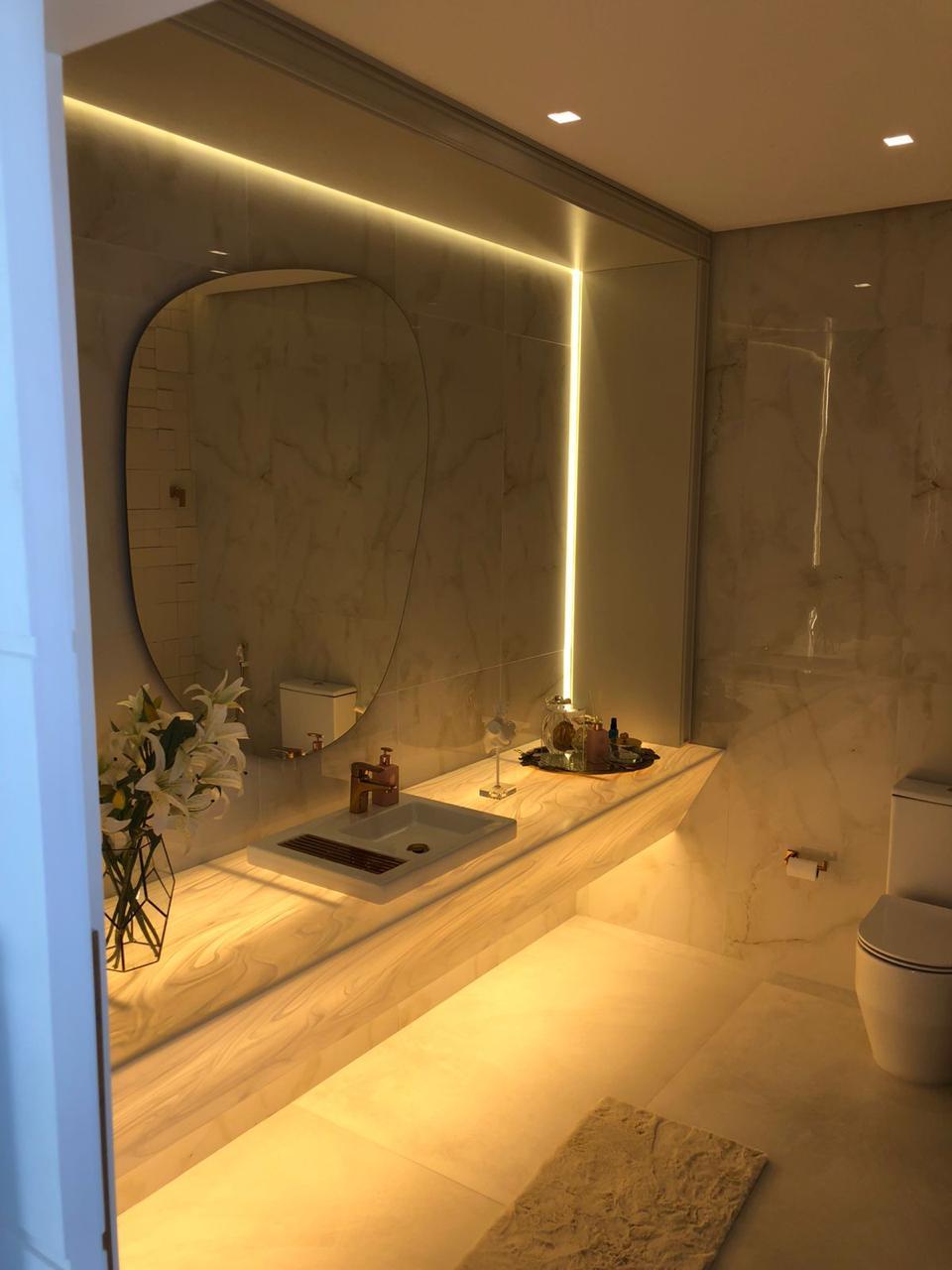 Lavabo com bancada iluminada em Corian®